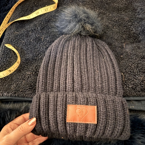 Leeman Accessories - 💙 Navy Poof Beanie with Sacred Heart Symbol